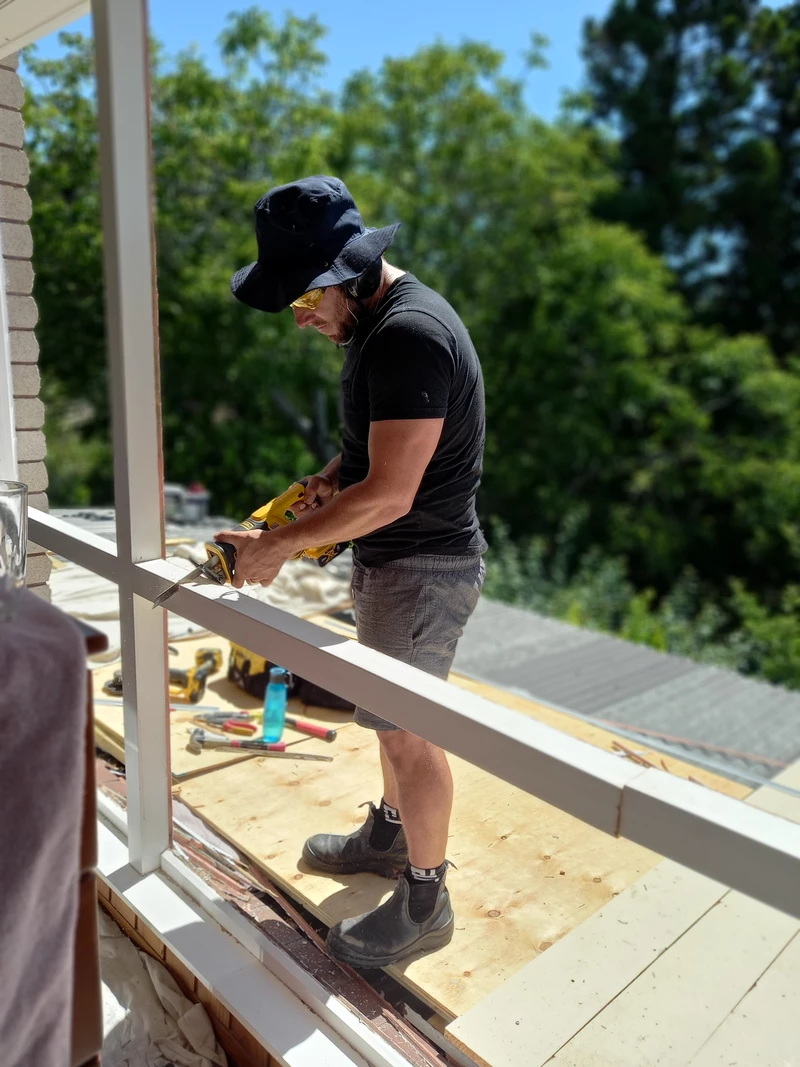 Jason Legg from Window and Door Rescue working on a window installation in Tauranga
